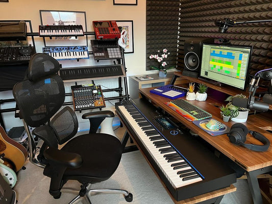 A modern music producer working on beats using a digital audio workstation.